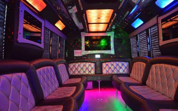 Party bus lounge with LED ceiling – Woody Creek limo service